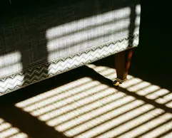 a shadow of a couch on the floor