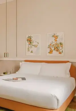 a bed with a tv and a table in a room