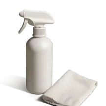 a white spray bottle and a white cloth