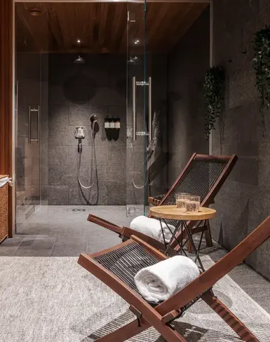 a room with chairs and a shower