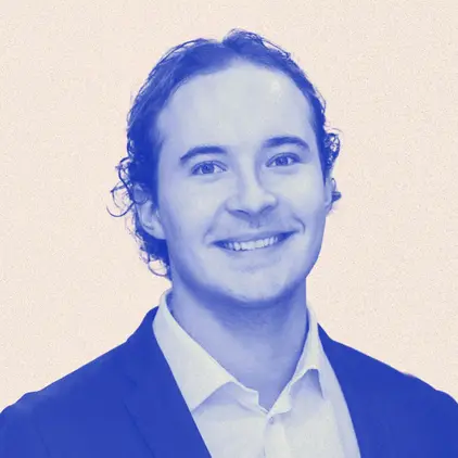 a man wearing sunglasses and a blue shirt