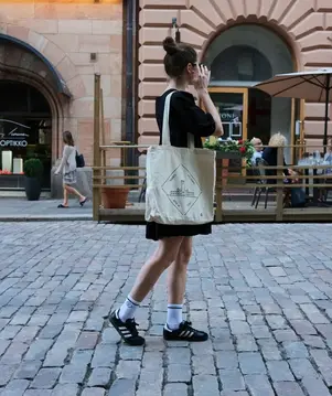 Woman walking down a street.