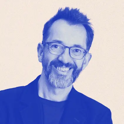 a man wearing glasses and a black jacket