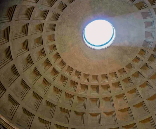 a ceiling with a light in the middle