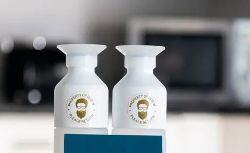 a couple of white bottles on a blue box