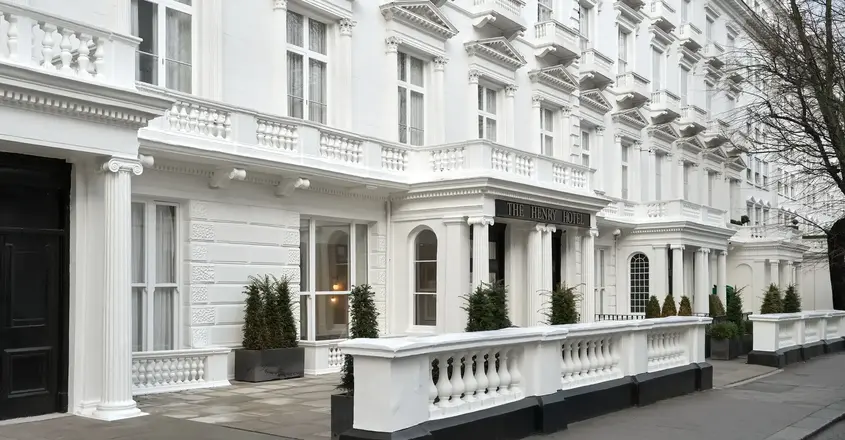 a white building with columns and balconies